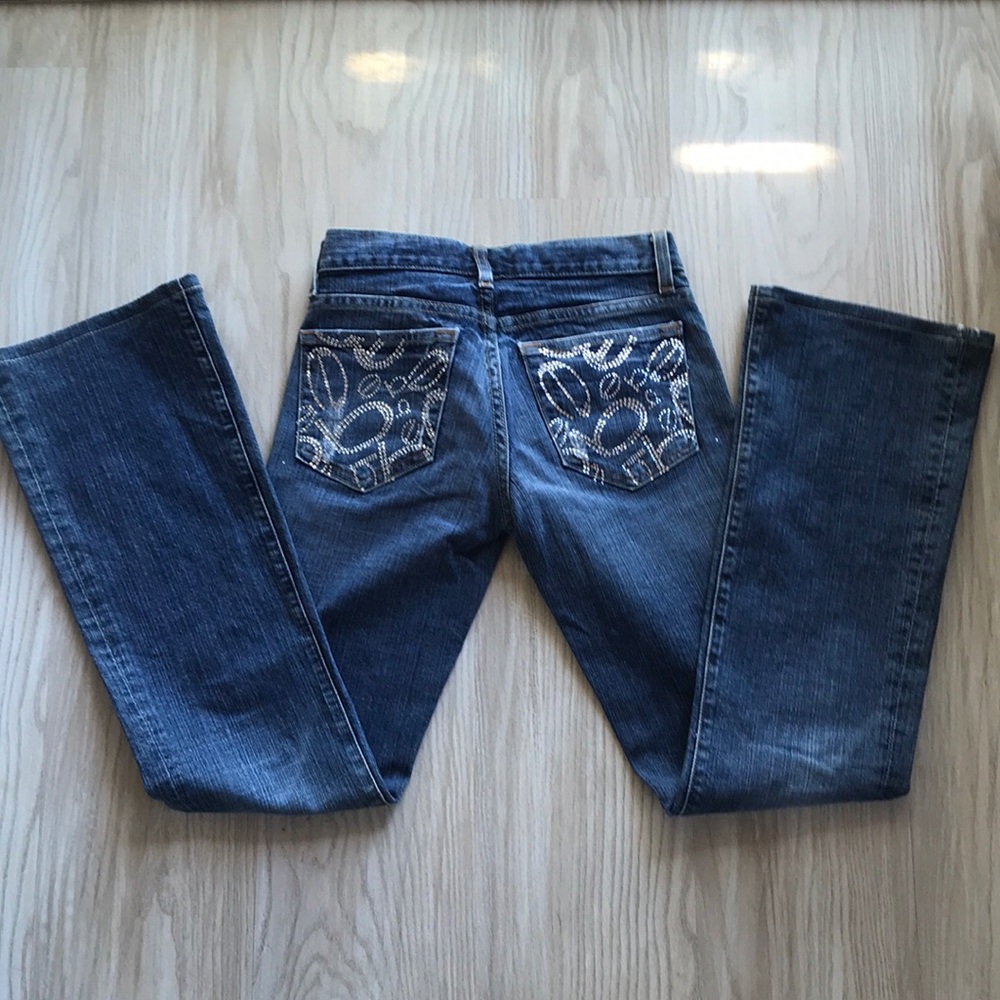 Bebe blue denim jeans with rhinestones.